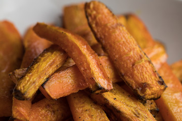 Carrot fries with crispy crust closeup shot visible texture