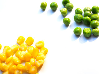 Yellow corn and green peas, diet food for health isolated on white background with copy space.