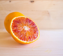 red Sicilian oranges full of vitamins on the wooden background, special Mediterranean diet