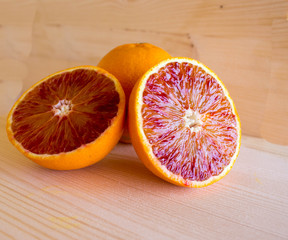 red Sicilian oranges full of vitamins on the wooden background, special Mediterranean diet