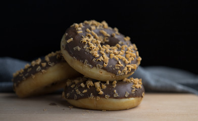 Donut with chocolate caramel and sweet sprinkles
