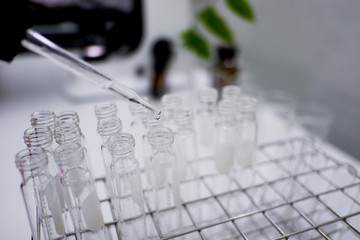 Cropped shot view of  the equipment and science experiments in Laboratory, Chemical substances for research and analyzing a sample under the microscope in laboratory. 
