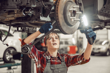 Technician holding work tools in her hands