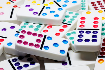 colorful dominoes in a pile on a table