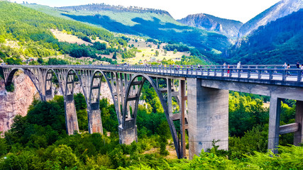 Fototapeta na wymiar Djurdjevica Bridge is a concrete arch bridge over the Tara River in northern Montenegro. 
