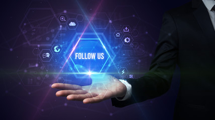 Man hand holding FOLLOW US inscription, social media concept