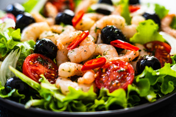 Prawn salad on black stone board