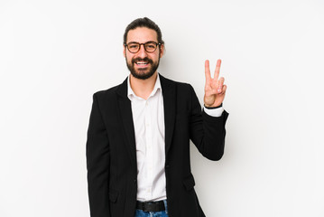 Young caucasian business man isolated on a white background showing victory sign and smiling broadly.