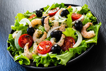 Prawn salad on black stone board