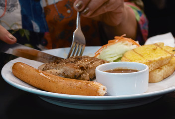sausage steak with chicken and garlic bread background