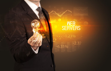 Businessman holding lightbulb with WEB SERVERS inscription, Business technology concept