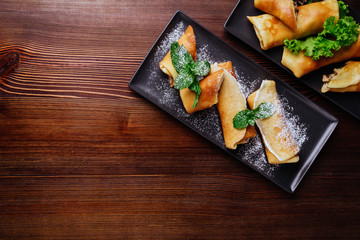 Delicious Tasty Homemade crepes or pancakes with raspberries and blueberries for breakfast