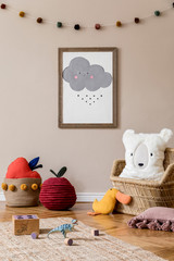 Stylish scandinavian interior of child room with natural toys, hanging decoration, design furniture, plush animals, teddy bears and accessories.  Interior design of kid room. Mock up poster frame.