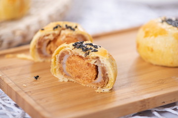 The delicious yolk is crisped in a wooden tray