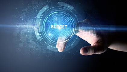 Hand touching BUDGET button, modern business technology concept