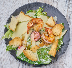shrimp salad with greens and croutons