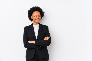 Middle aged african american business  woman against a white background isolated smiling confident with crossed arms.