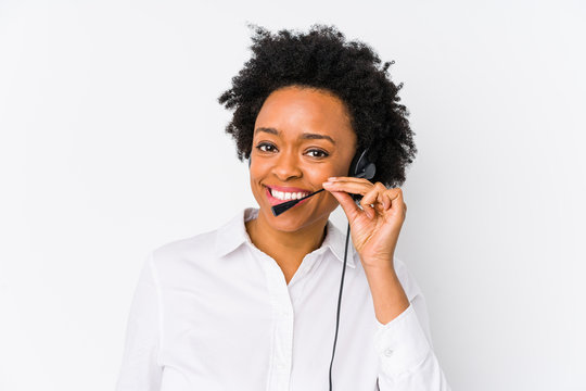 Young african american telemarketer woman isolated showing a mobile phone call gesture with fingers.