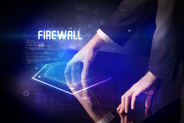 Hand touching digital table with FIREWALL inscription, new age security concept