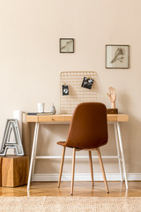 Minimalistic scandinavian interior of home office space with a lot of mock up photo frames, wooden...