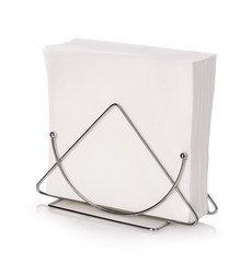 Table napkin holder with napkins isolated on white background.