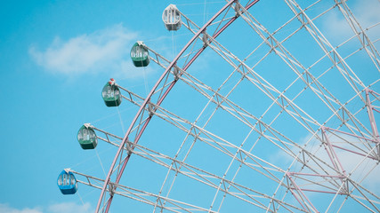 Ferris Wheel Over Blue Sky Background