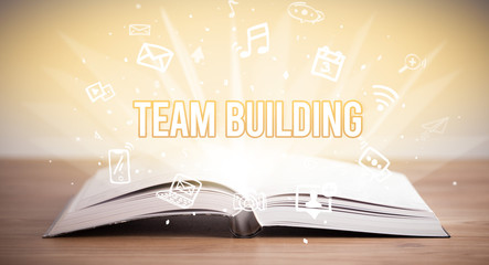 Opeen book with TEAM BUILDING inscription, business concept