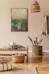 Boho composition of living room with design chaise longue, pillows, baskets, paintings, rattan...