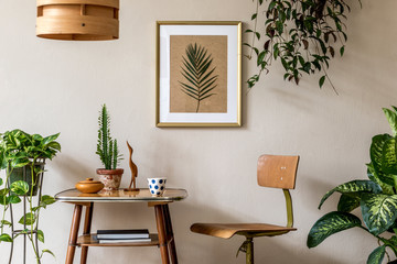 Retro interior design of living room with stylish vintage chair and table, plants, cacti, personal...
