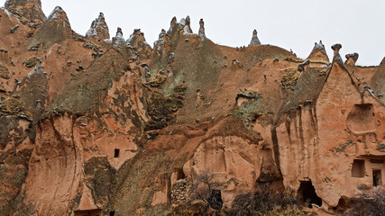 Naklejka premium Cave houses and monasteries carved into Tufa Rocks at Zelve Open Air Museum (Zelve Valley) in winter season in Cappadocia, Turkey