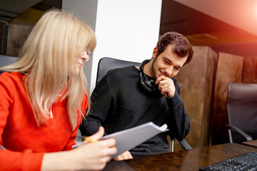 Group of business people and software developers working as a team in office
