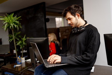 Developing programming and coding technologies. Website design. Programmer working in a software...