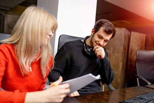 Group of business people and software developers working as a team in office