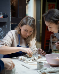 Fototapeta premium Woman making ceramic pottery. Concept for woman in freelance, business.
