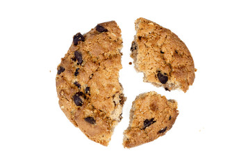 Close up of chocolate chip cookie pieces with crumbs isolated on white background.