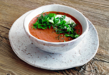 pureed borsch with sour cream, dill, and parsley 