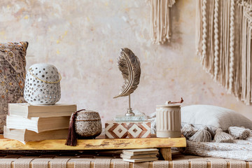 Stylish oriental living room with design beige chaise longue, beautiful macrame, pillows, wooden...