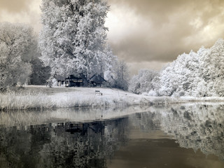Obraz na płótnie Canvas infrared photo: landscape with river, and amazing beautiful trees and glare
