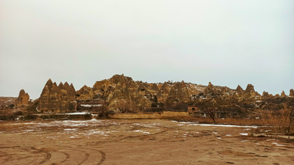 Cave houses and monasteries carved into Tufa Rocks at Zelve Open Air Museum (Zelve Valley) in winter season in Cappadocia, Turkey