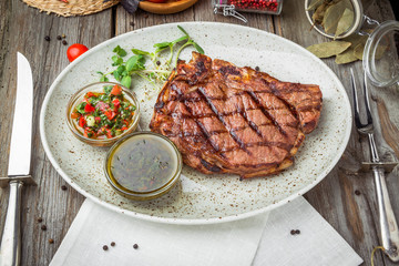 Tenderloin steak on plate with sauce
