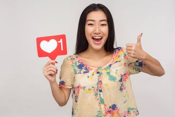 Put Like to social media content! Joyful enthusiastic asian girl showing internet heart icon and...