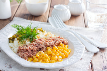Homemade salad with canned tuna and corn, selective focus