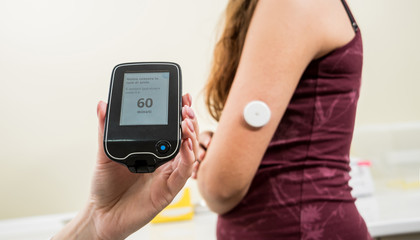 Medical device for glucose check. Continuous glucose monitoring pod. 