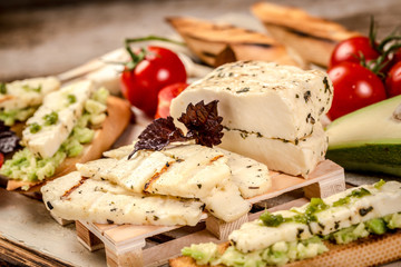 Assortment of different cheese. The concept of eco products. Organic farm dairy products, cheeses. Parmesan, feta, goat cheese. Background image. Copy space