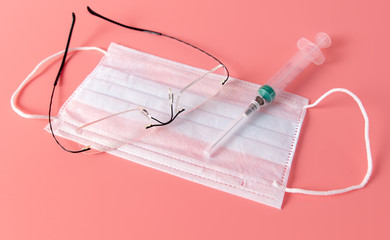 Mask, glasses and syringe