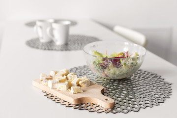 Healthy breakfast of fresh salad and cheese