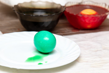 Painting eggs in the kitchen.