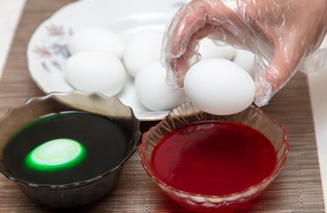 Painting eggs in the kitchen.