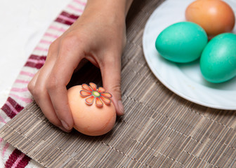 Decorating eggs in the kitchen.
