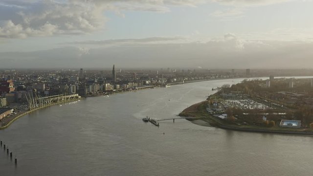 Antwerp Belgium Aerial v39 Flying down over Scheldt River dock with cityscape views at sunset - November 2019